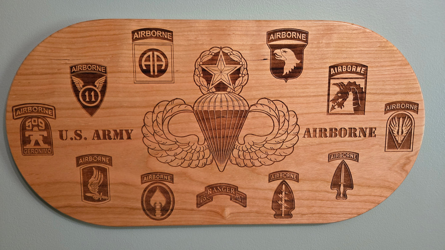 Solid cherry plaque with master parachutist wings and Army airborne unit patches.