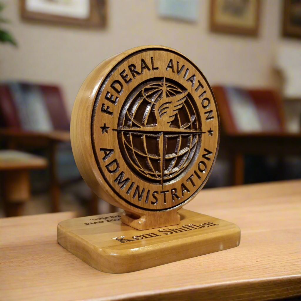 Double‑sided solid wood desk carving featuring FAA insignia and custom engraving, designed as a professional gift for Federal Aviation Administration employees.