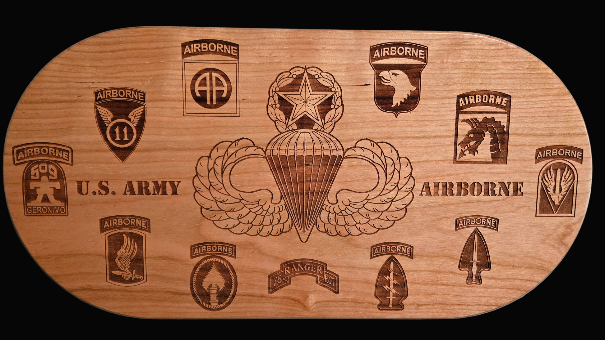 Solid cherry plaque with master parachutist wings and Army airborne unit patches.