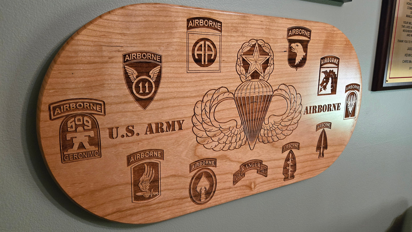 Solid cherry plaque with master parachutist wings and Army airborne unit patches.