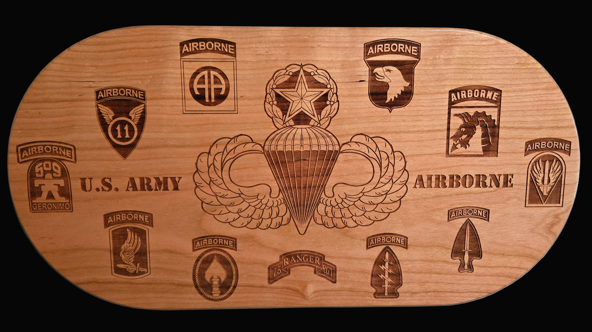 Solid cherry plaque with master parachutist wings and Army airborne unit patches.