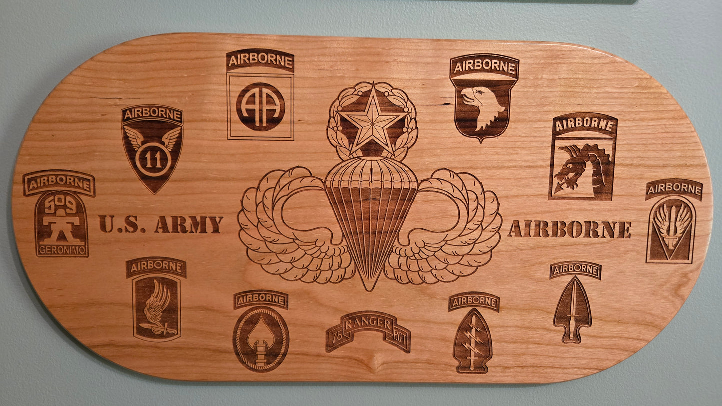 Solid cherry plaque with master parachutist wings and Army airborne unit patches.